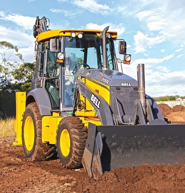 Bell 315SL backhoe loader in operation moving earth