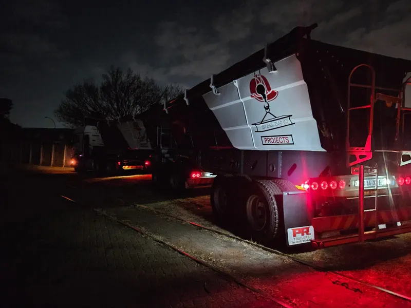 SteelBand Projects side tipper trailer at night